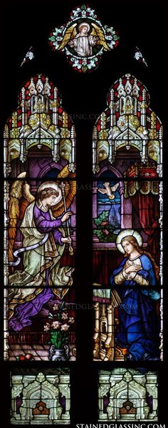 a stained glass window depicting the birth of jesus