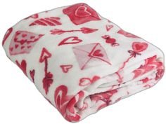 red and white blanket with hearts, arrows, and symbols on it's edges