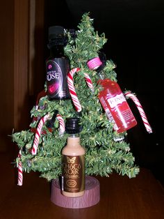 a small christmas tree is decorated with candy canes