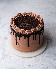 a cake with chocolate icing and sprinkles on top