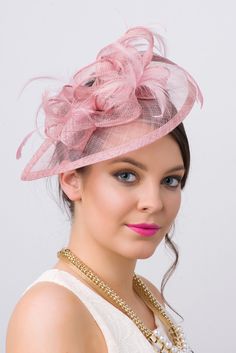 Timeless glamour. This sassy fascinator gives a nod to vintage style with a bouncy mesh ribbon and flighty feathers. With its classic sinamay mesh shape and elegant look it will be your go-to fascinator for the season. - Light weight - Attached to headband for easy wear - Comes in 18 bold colors Classy Hats, Pink Fascinator, Pretty Hats, Red Hat Society, Sinamay Hats, Hat Fascinator, Kentucky Derby Hats, Fancy Hats, Mesh Hat