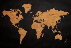 a wooden world map with black background