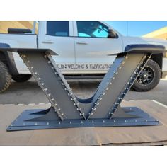 the front end of a truck with metal studs on it