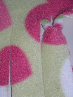 a pink and white dress with hearts on it