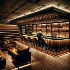 a man is sitting at the bar in a dimly lit room with chairs and stools