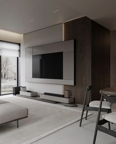 a living room with a large flat screen tv mounted to the side of a wall