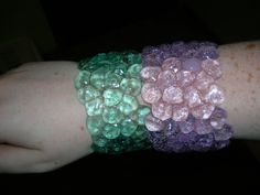 two bracelets that have different colored beads on them