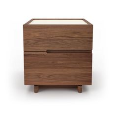 an image of a wooden nightstand with glass top and drawer on the bottom side, against a white background