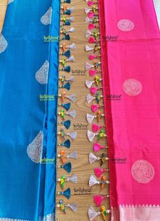 three different colored sari with beaded borders on each side and one in the middle