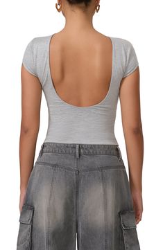 A cropped top presents as simple and standard from the front but serves seriously sultry vibes in the back. 18 1/2" length (size Medium) Boat neck lined Short sleeves Open back 95% rayon, 5% spandex Machine wash, tumble dry Imported Fitted Low-cut Crop Top With Built-in Bra, Fitted Low-cut Top With Built-in Bra, Fitted Crop Top With Built-in Bra For Summer, Summer Low-cut Crop Top With Built-in Bra, Spring Scoop Neck Crop Top With Built-in Bra, Scoop Neck Crop Top With Built-in Bra For Spring, Fitted Crop Top With Built-in Bra And Scoop Back, Low-cut Crop Top With Built-in Bra, Stretch Elastane Crop Top For Summer