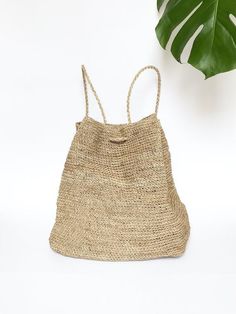 A unique piece, handmade to order specially for you, by artisans from Santander, Colombia. This is a beautiful, simple and stylish backpack 100% made of Fique natural fiber. It is the perfect summer accessory to be used out in the city or at your favorite vacation spot. It has two easy to carry shoulder straps that also serve as a drawstring closure. Super practical and lightweight, you will want to carry it around everywhere you go! Approximate Dimensions:Height: 13.8" / 35 cmWidth: 12.6” / 32 Beach Crochet Backpack, Daily Use Straw Backpack, Summer Beige Shoulder Bag Backpack, Rectangular Backpack For Beach, Handmade Natural Backpack For Everyday Use, Beige Shoulder Bag Backpack For Summer, Beige Backpack For Summer Vacation, Summer Rectangular Brown Backpack, Summer Vacation Beige Backpack