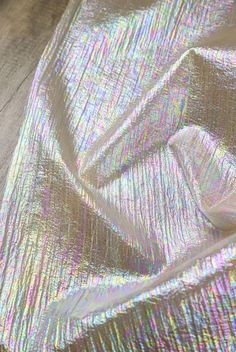 an image of shiny fabric on the floor