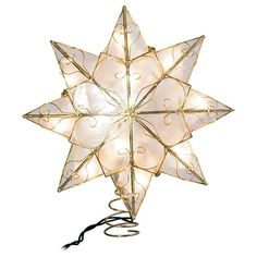 a lighted moravian star decoration on a white background