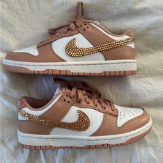 Light Pink Dunks With Rhinestones On The Outside Swoosh Luxury Custom Sneakers With Rhinestones And Round Toe, Luxury Bedazzled Low-top Sneakers, Luxury Bedazzled Sneakers, Luxury Bedazzled Round Toe Sneakers, Pink Dunks Low, Light Pink Dunks, Rhinestone Nike, Pink Dunks, Bling Nike Shoes