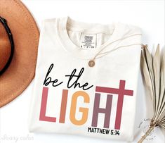 Comfort Colors® Be The Light Matthew 5:14 Shirt, Inspirational T-shirt, Christian Outfit, Faith Tee, Religious Clothing, Bible Verse Shirts Hi, thank you so much for shopping with us! ❤️ ◦ ◦ ◦ ◦ ◦ size and material ◦ ◦ ◦ ◦ ◦ ◦ Comfort Colors® Original Garment-Dyed T-shirt ◦ Unisex Adult T-Shirt ◦ Soft and comfy ◦ Garment-dyed and soft-washed for a comfortable vintage look and feel ◦ Relaxed fit ◦ 100% ring-spun cotton ◦ The way that we print our sweatshirts is Direct-to-Garment printing, meaning that the ink is printed INTO the shirt. This provides an extremely durable and professional look (not vinyl).  ❤️❤️ IF YOU WANT AN OVERSIZED LOOK PLEASE CHOOSE A SHIRT THAT IS 2 SIZES LARGER THAN YOUR USUAL SIZE  ◦ ◦ ◦ ◦ ◦ care instructions ◦ ◦ ◦ ◦ ◦ ◦ Machine wash: cold (max 30C or 90F) ◦ Do not b Be The Light Shirt, Bible Verse Shirts, Matthew 5, Faith Tees, Be The Light, Professional Look, Christian Clothing, Dye T Shirt, The Light