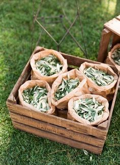 some food is sitting in a wooden box on the grass and ready to be eaten