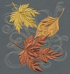 three autumn leaves on a blue background