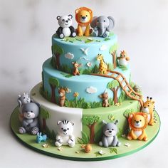 a three tiered cake with animals on it