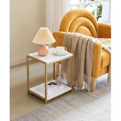 a living room with a yellow chair and a white coffee table on top of it