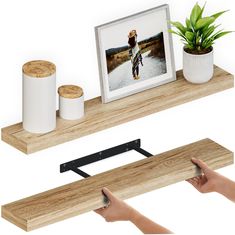 two wooden shelves with pictures and candles on them, one is holding a photo while the other holds a potted plant