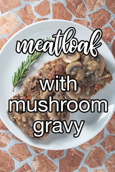 meatloaf with mushrooms and gravy on a white plate next to a sprig of rosemary