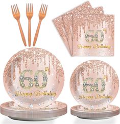 a set of pink and gold 50th birthday party plates with forks, spoons and napkins