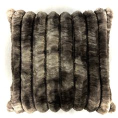 the fur pillow is made out of faux and has five rows of stripes on it