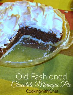 an old fashioned chocolate meringue pie on a table