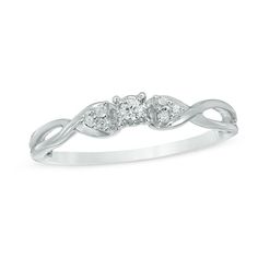 a white gold ring with three diamonds