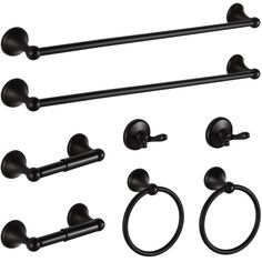 an assortment of black bathroom accessories including towel rings, toilet paper holders and ring handles