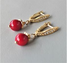 There lovely red coral earrings gold with CZ will be a perfect wedding anniversary gift, unique birthday gift, Mothers day gift or graduation gifts for her women wife girl, grandma niece mom, sister daughter aunt or best friend gift. Handmade jewelry gift is always especial gift. Coral drop earrings length: 1 1/4 inc / 3,3 cm. 24K gold plated finish with CZ CORAL: ♥ Absorbs negative energy ♥ Platonic love ♥ Friendship ♥ Community ♥ Creativity ♥ Passion ♥ Romantic love ♥ Wisdom ♥ Optimism ♥ Enthu Elegant Handmade Red Earrings, Elegant Coral Earrings For Formal Occasion, Elegant Coral Jewelry For Anniversary, Red Dainty Earrings For Anniversary, Elegant Coral Drop Earrings, Coral Earrings For Gift, Coral Elegant Jewelry With Matching Earrings, Elegant Coral Dangle Earrings, Elegant Coral Jewelry For Gift