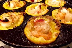 some food is cooking in a pan on the stove top and ready to be eaten