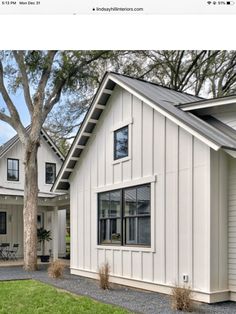 a white house with black trim and windows