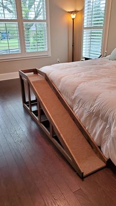 a bed with a ramp on top of it in a bedroom