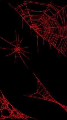 some red spider webs on a black background