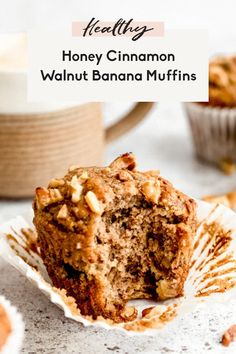 a close up of a muffin on a plate with the words healthy honey cinnamon walnut banana muffins