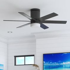 a ceiling fan in a white living room