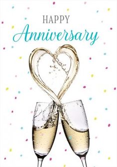 two glasses of champagne with the words happy anniversary