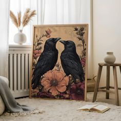 two black birds sitting next to each other on a rug