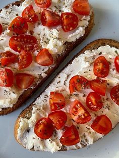 two slices of bread topped with tomatoes and cheese