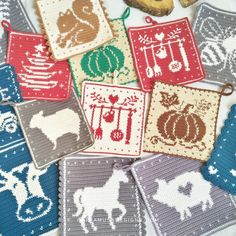 cross stitch coasters with farm animals and pumpkins on them, all in different colors