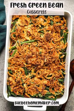 green bean casserole in a white dish with text overlay that says fresh green bean casserole