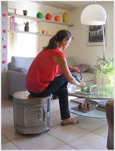 a woman sitting on top of a glass table