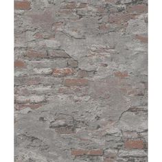 an old brick wall with grey and red paint