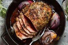 a roasting pan filled with meat and vegetables