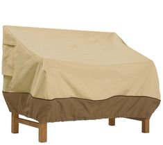 an outdoor furniture cover on top of a wooden chair with a white back and brown sides