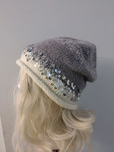 "Welcome to my Etsy \"SuddenGoods\" shop!   PRODUCT DETAILS  Winter Beanie hat in Luxurious Mink Down, Cozy Sparkling Sequins, Wool Hat in Elegant light Purple and Gray, Fashionable Women's Warm Headwear. Indulge in winter elegance with our exquisite women's beanie crafted from sumptuous mink down, ensuring unparalleled softness and warmth. Adorned with sparkling sequins, this chic accessory seamlessly combines fashion and function. The wool blend adds an extra layer of coziness, making it perfect for chilly days in stunning blue and gray hues. Carefully handcrafted, this beanie is a must-have for the fashion-forward. To maintain its pristine condition, hand wash gently in cold water with a mild detergent and lay flat to dry.  Elevate your winter style with this luxurious beanie, offering Luxury Wear, Winter Cap, Knitted Beanie, Winter Hats Beanie, Women's Beanie, Handmade Hat, Winter Beanie, Unique Gifts For Her, Purple Gray