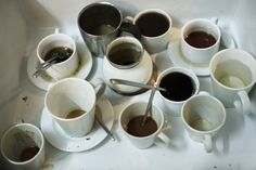 there are many cups and spoons that have been filled with different kinds of coffee