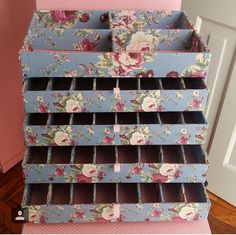 a blue and pink flowered drawer with drawers