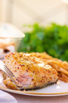 a white plate topped with meat and french fries